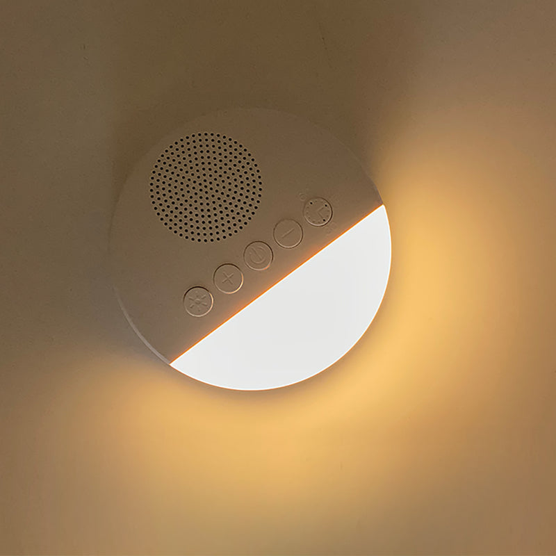 Veilleuse bruit blanc diffusant une lumière chaude et rassurante pour la nuit.